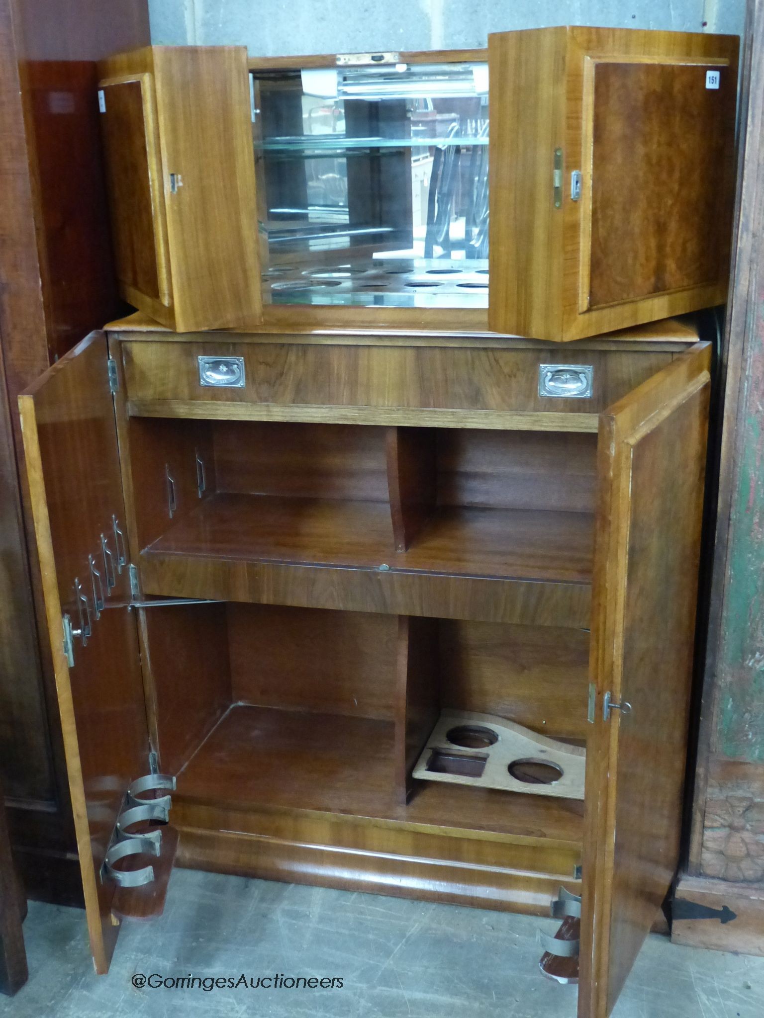 An Art Deco burr walnut veneered cocktail cabinet, length 94cm, depth 39cm, height 144cm